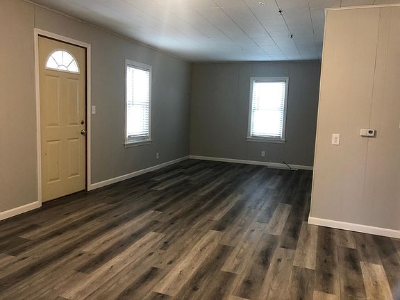 living room has newer vinyl plank flooring