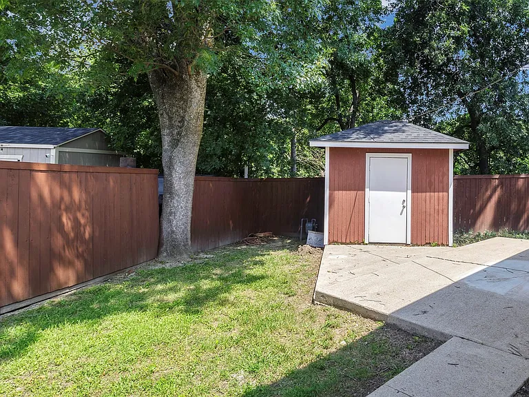 View of backyard with a shed