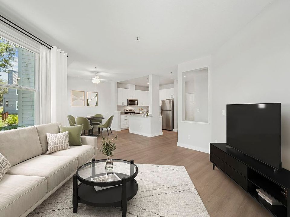 Renovated Package I living room with hard surface flooring