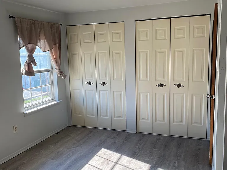 Third Floor: Master bedroom with attached door to shared bathroom.