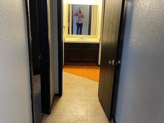 Hallway to downstairs bath an bedroom