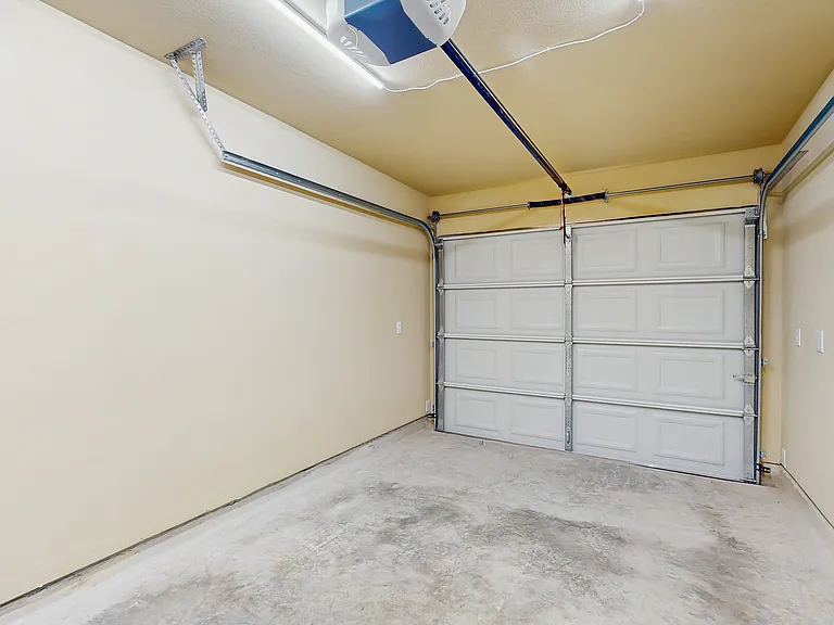 Garage, each unit has a 1 car garage with #8 wiring and 40A breaker for EV charger.