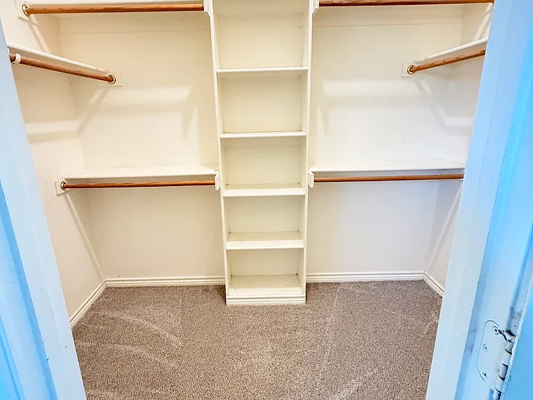 large walk in closet in master bedroom