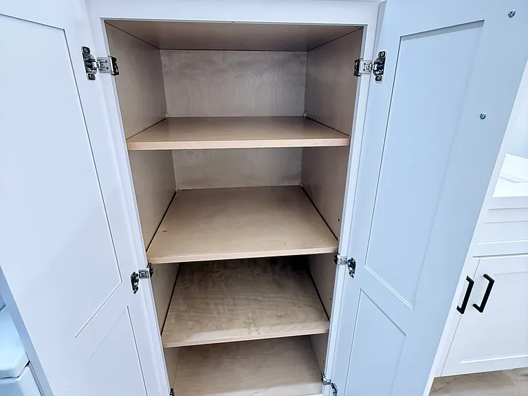 Upper and Lower Linen cabinets.