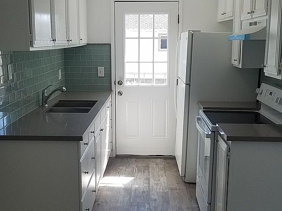 Beautiful remodeled kitchen with granite top and glass tile back splash, new glass top stove