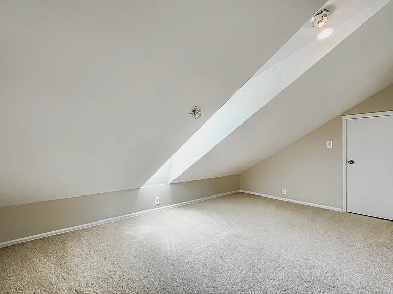 Large loft over the kitchen with extra storage closet and skylight (that opens!) offering dramatic views of the flatirons and sunsets