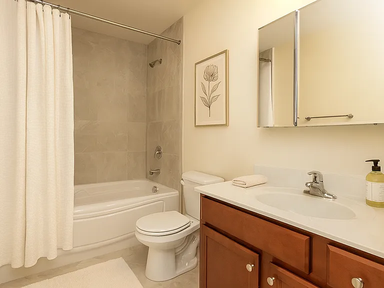 Six-foot tub with tile-accented shower surround.