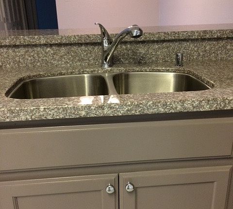 Kitchen sink with soap dispenser