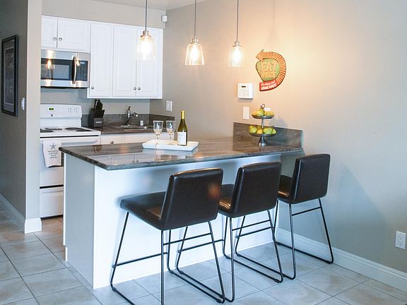 Kitchen with full size appliances including dishwasher.