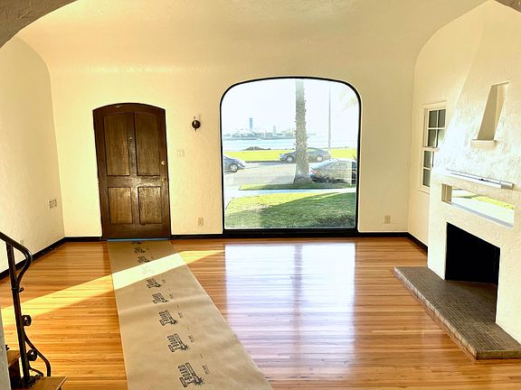 Formal living room with ocean views and decorative fireplace.