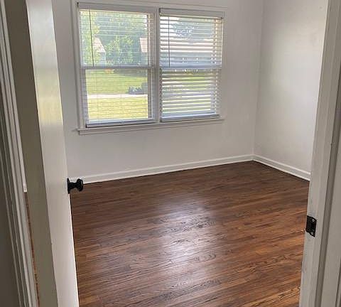 BEDROOM 1 - FACING STREET WITH WALK-IN CLOSET