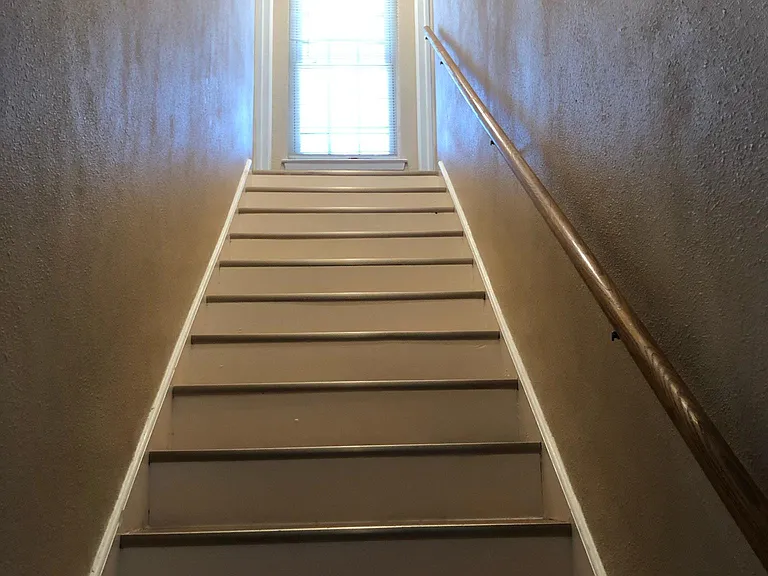 stairways to upstairs 2 bedrooms/ 2 baths