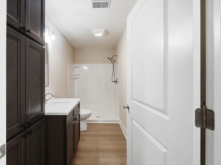 First floor bathoom 
with walk in shower 
with linen closet