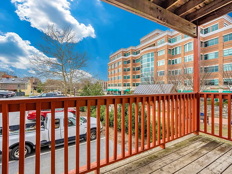 Relax on your private balcony with views of the bustling plaza and elegant architecture.