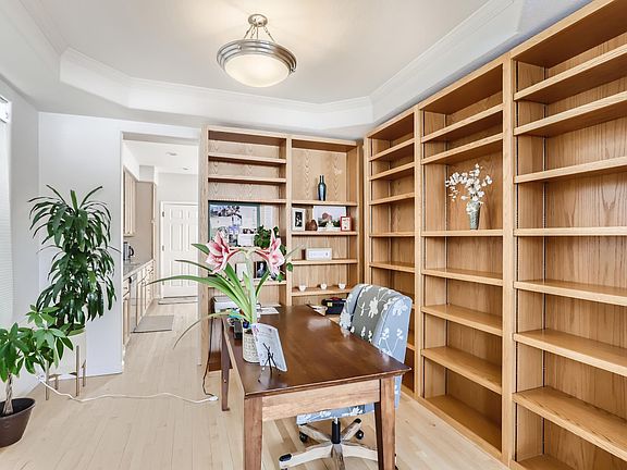 room with oak shelving off the kitchen, windows on left facing east. Shelving not to be removed