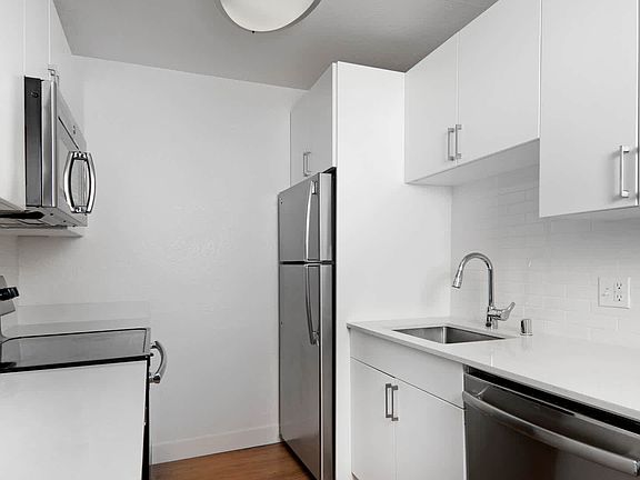 Kitchen with Stainless Steel Appliances and Quartz Countertops
