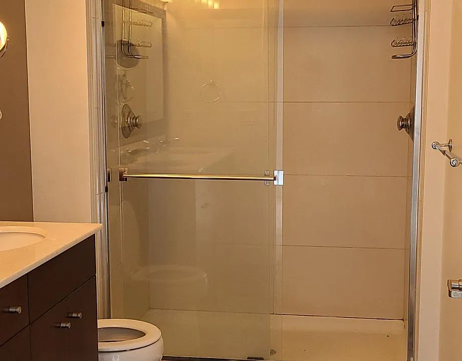 Master bathroom has double shower and marble tiled floors.
