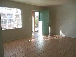 Living room, there is a small front porch