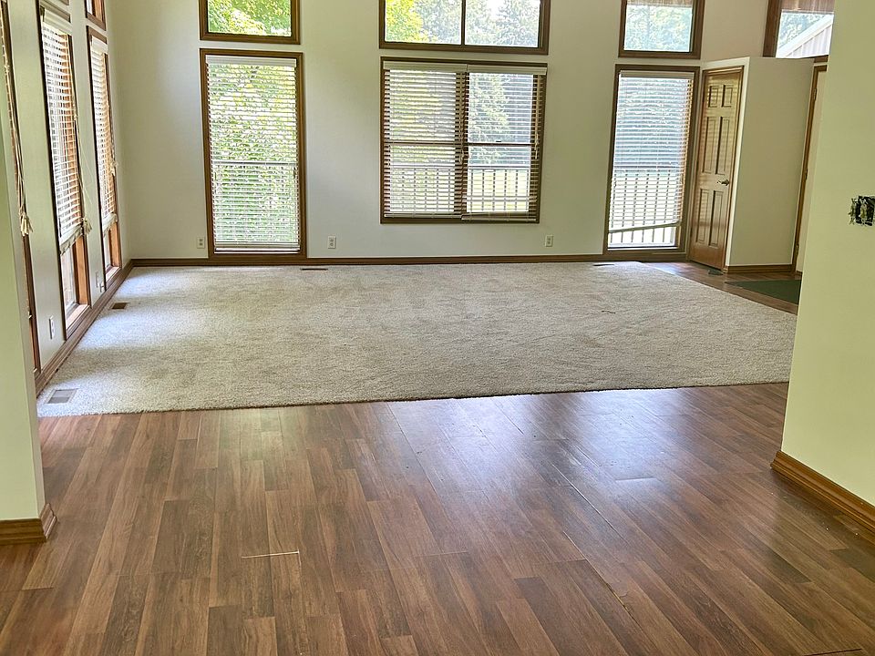 Open concept layout maximizes the space and allows for tons of natural light from the vaulted ceilings and high windows.
