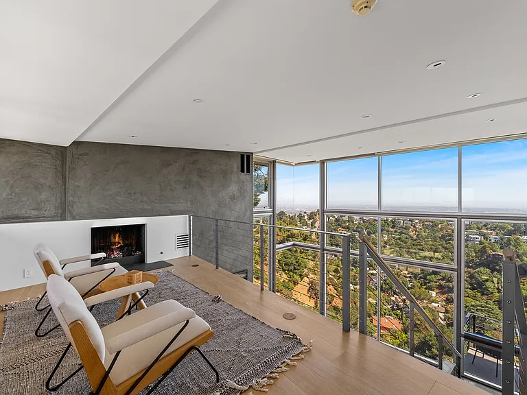 Merkaba Home living room with open modern design, expansive windows, and serene canyon surroundings. A unique luxury retreat in the Hollywood Hills of Los Angeles.