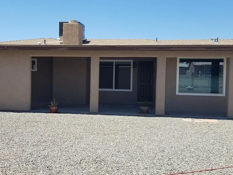 Covered back patio the length of home