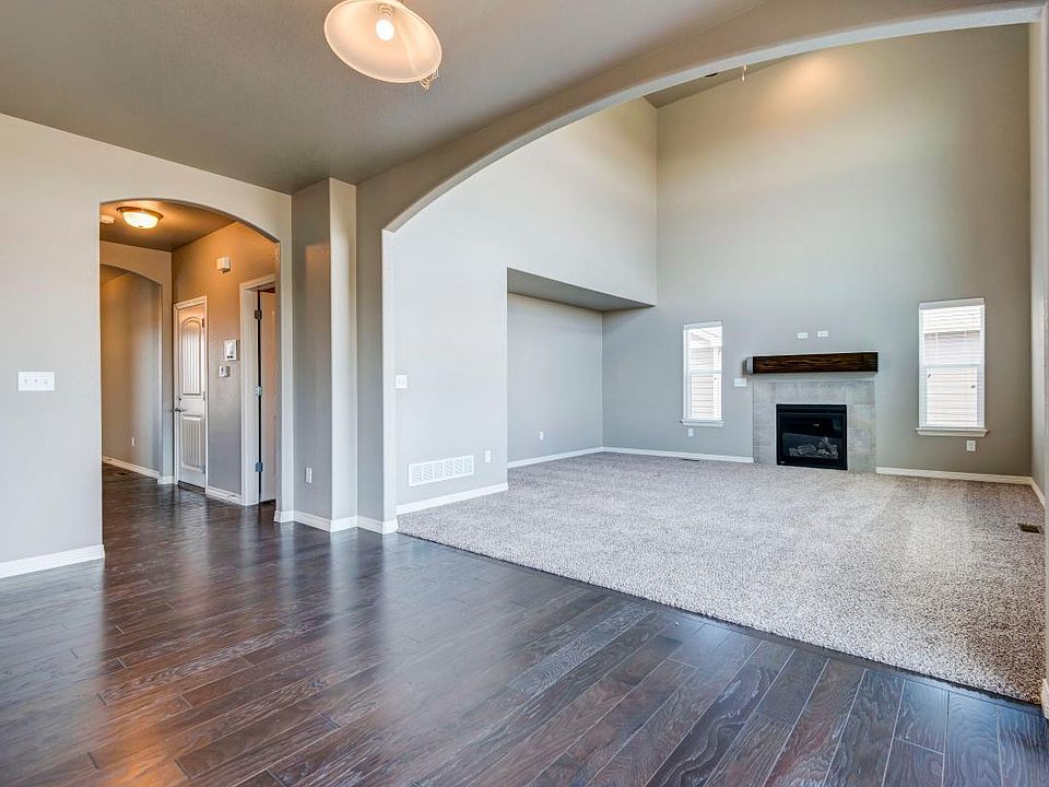 Kitchen Informal Dining Area/Living Room and Hallway to Front Door/Garage
