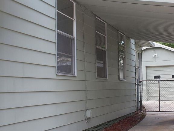 Side View with Carport and Garage