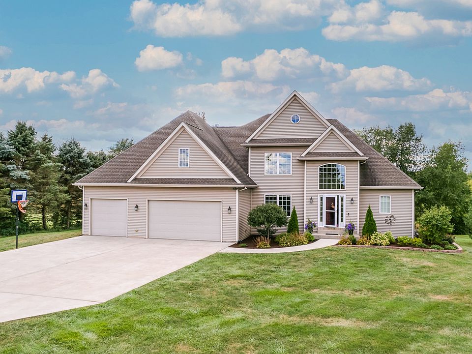 2 story - 4 car garage & expanded concrete drive