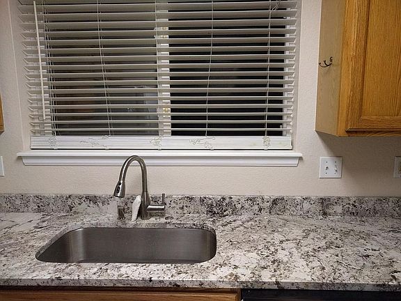 Kitchen sink and front window looking out front of house