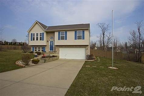 Another view of the front showing the amount of space on either side, fenced in wooded rear yard. If you are looking for space and room to breath between neighbors then this house is for you.