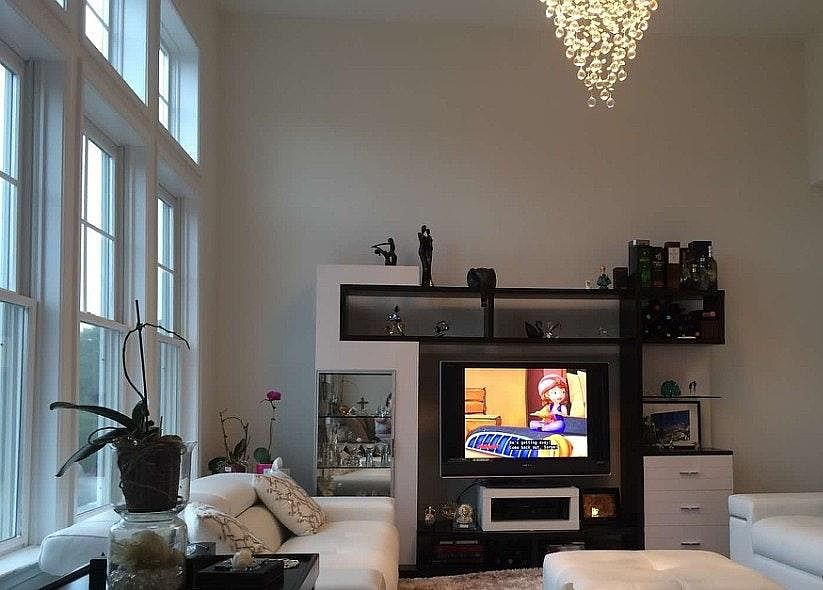 Amazing high ceiling living room with a lot of light