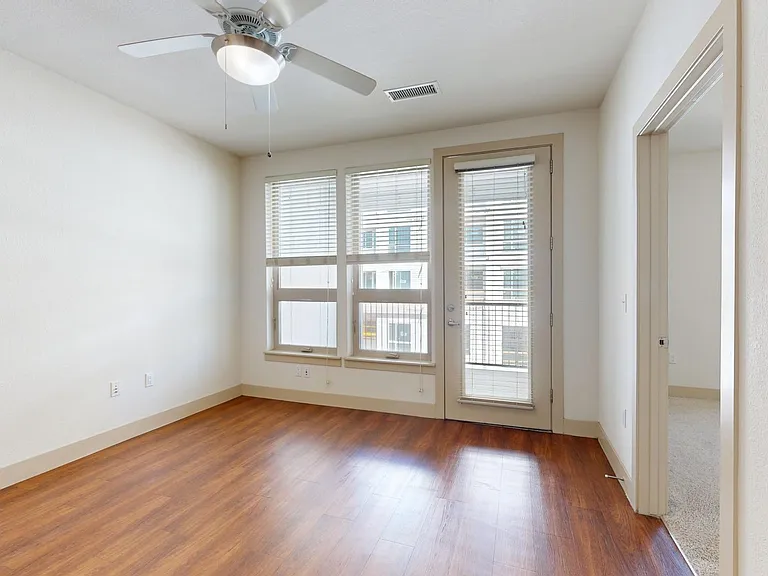 Apartment living room with wood-style flooring.