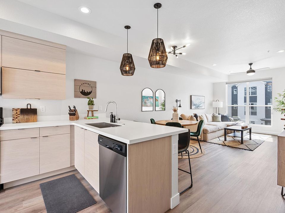 Looking at the kitchen bar, dining and living room