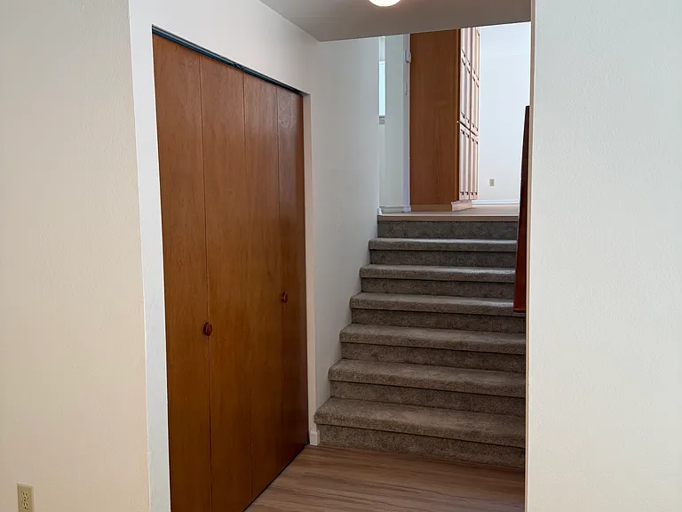 Half flight of stairs to family room