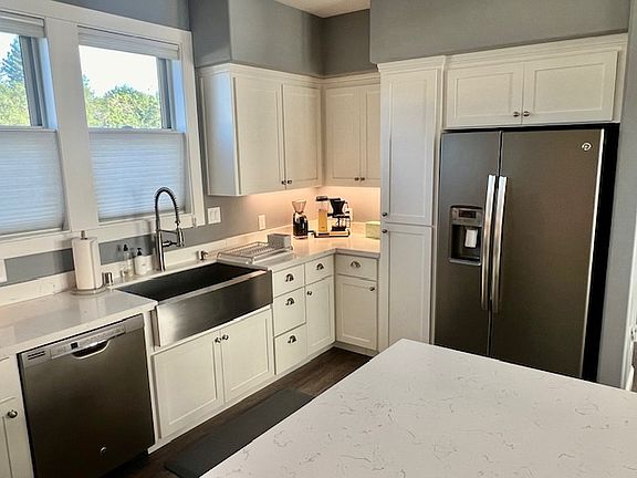 Stainless steel appliances with abundant storage.