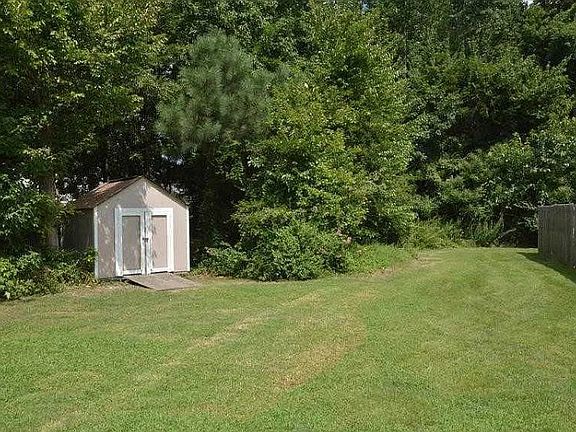 Play Yard (community property) behind backyard fence.