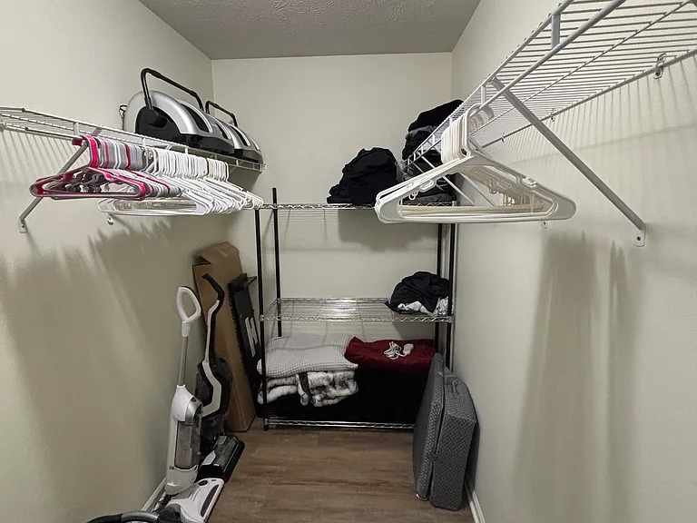 Primary bedroom walk in closet.