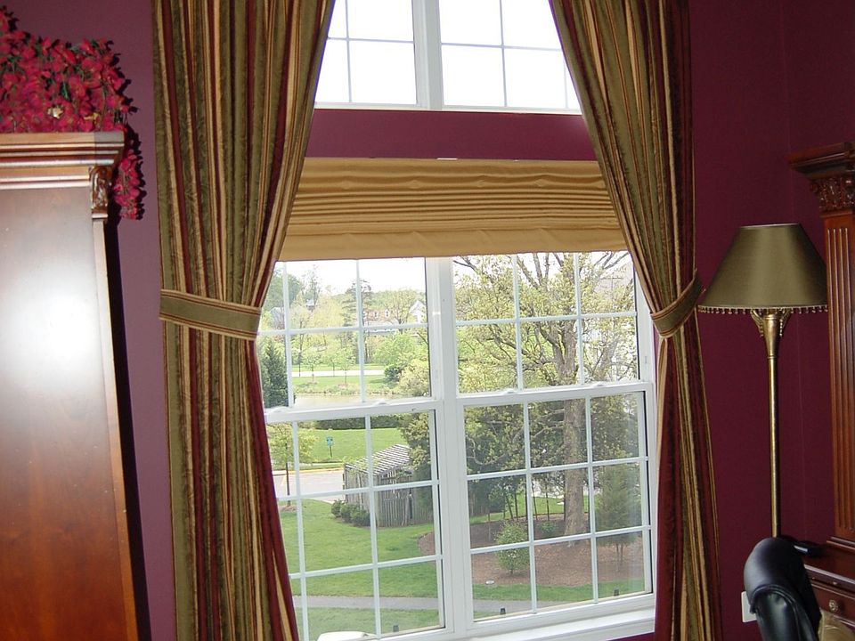 Den with beautiful window treatment