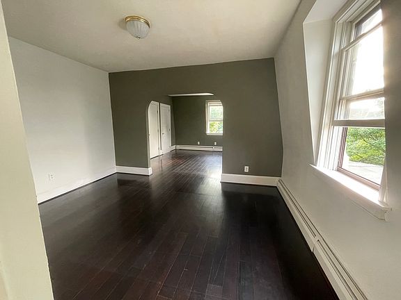 Front hall entrance into living room and then into dining room