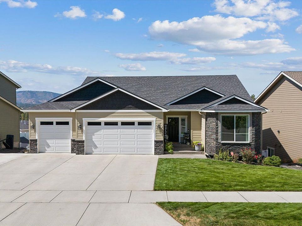 3 Car garage with extended driveway accommodating plenty of off-street parking.