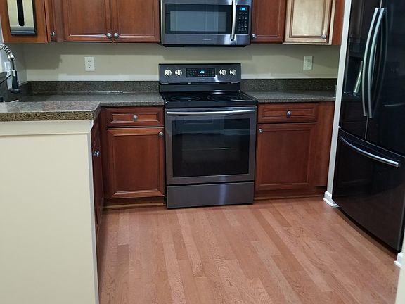 View of kitchen as soon as you get to the tom of the stairs of the unit