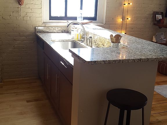 The island attaches to breakfast bar seating 4-5 people.