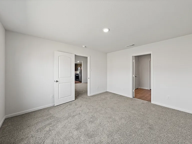 The master suite has a spacious bedroom, en-suite bathroom and walk-in closet.