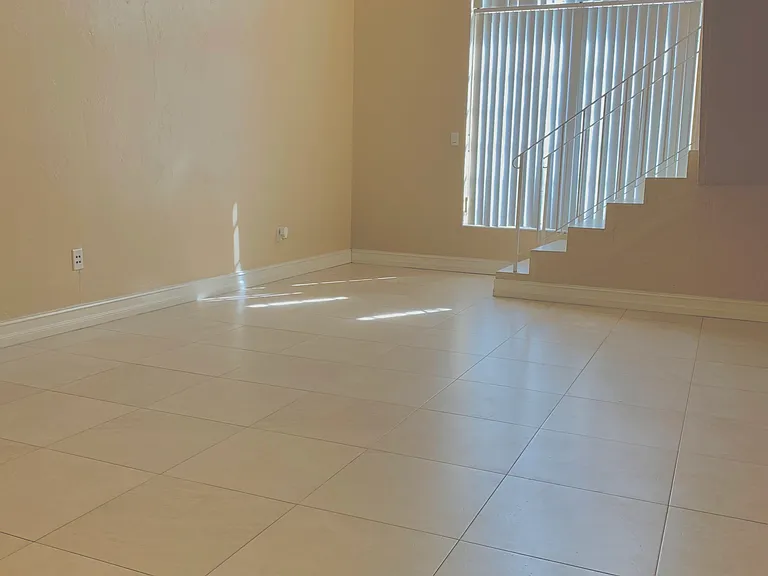 Spacious Open-Concept Loft-Style Greatroom that combines an inviting Living and Dining area, exuding elegance and comfort while maximizing natural light.
