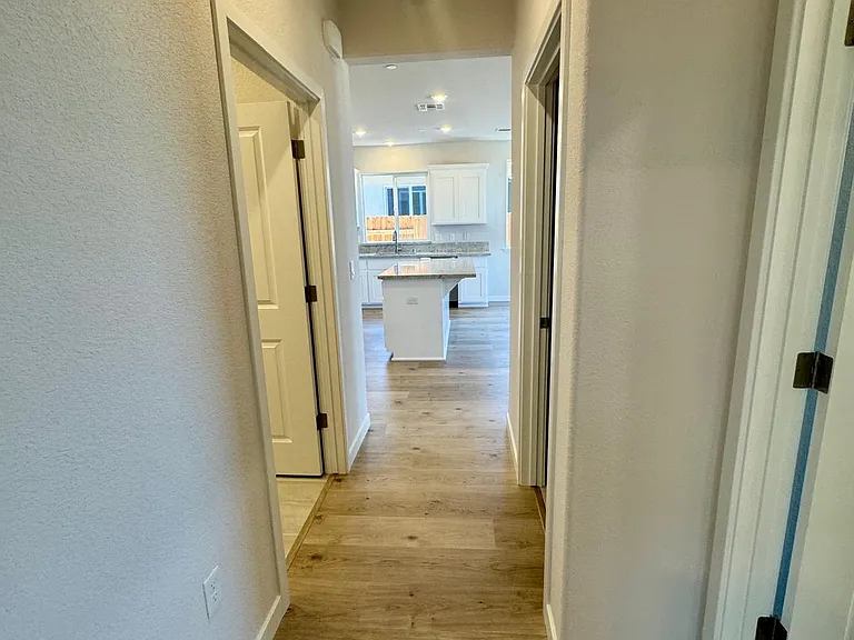 Hallway to two bedrooms including Master bedroom