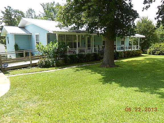 Another view of house front showing ramp from carport.