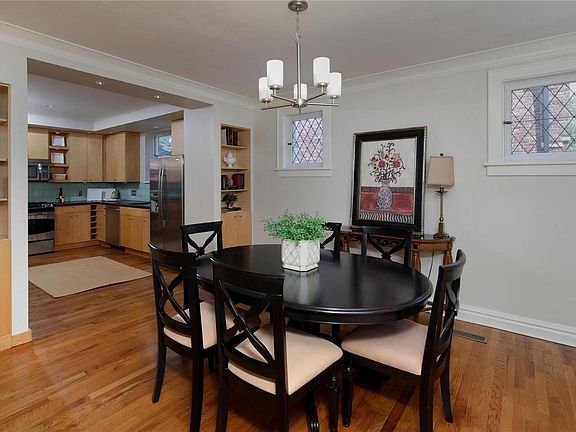 The dining room with custom built-in shelves with direct access to your Euro-style kitchen.