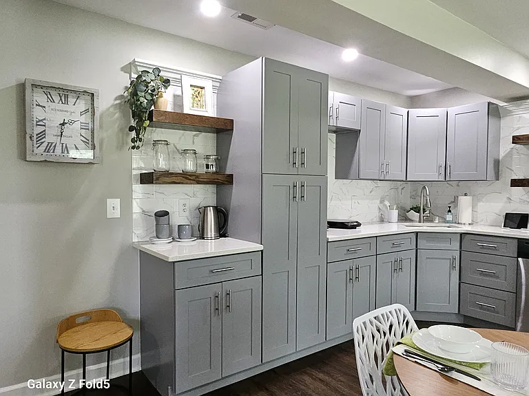 Huge double door pantry, custom floating shelves and tons of storage.