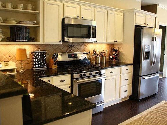 Designer Kitchen with Stainless Steel Appliances and French-