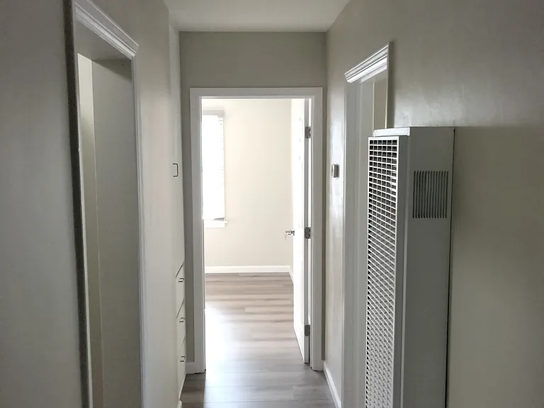 Short hallway between East and West Bedrooms, the Dining Room and the Long Hallway